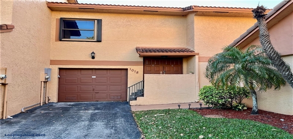 1018 SW 113th Ter # 117 Pembroke Pines Florida, 33025 | Canal-View Townhouse with Wraparound Patio & Garage