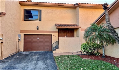 1018 SW 113th Ter # 117 Pembroke Pines Florida, 33025 | Canal-View Townhouse with Wraparound Patio & Garage