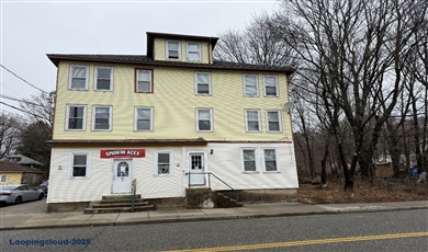  Exceptional Willimantic Investment: Modernized 7-Unit with Upside Potential