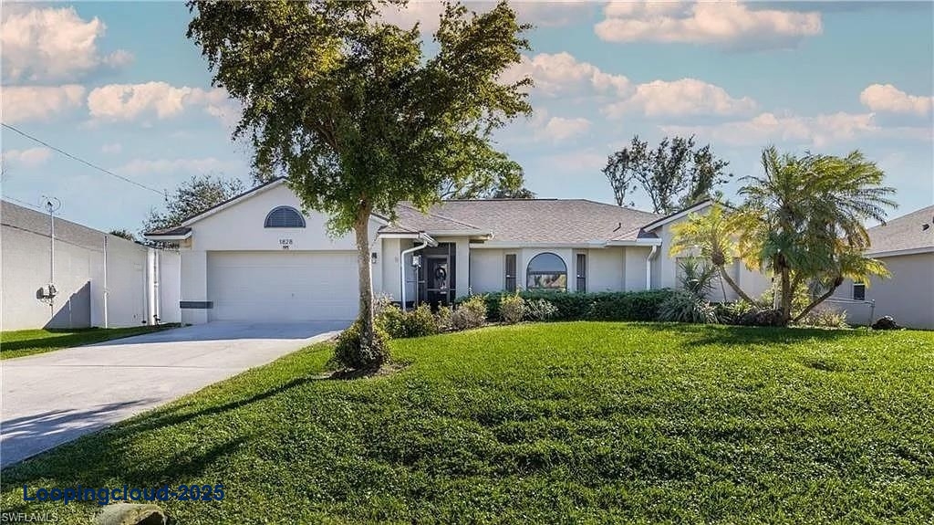 Stylish Cape Coral Home with Open Layout & Custom Fireplace