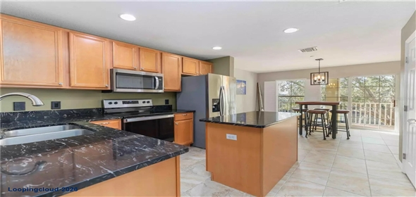 8614 MAJESTIC ELM CT Bradenton Florida, 34202 | Modern 3-Story Townhome with Pond Views & Designer Upgrades