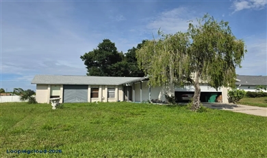 Single family home for sale at 586 ALTOONA ST NW Port Charlotte, FL 33948