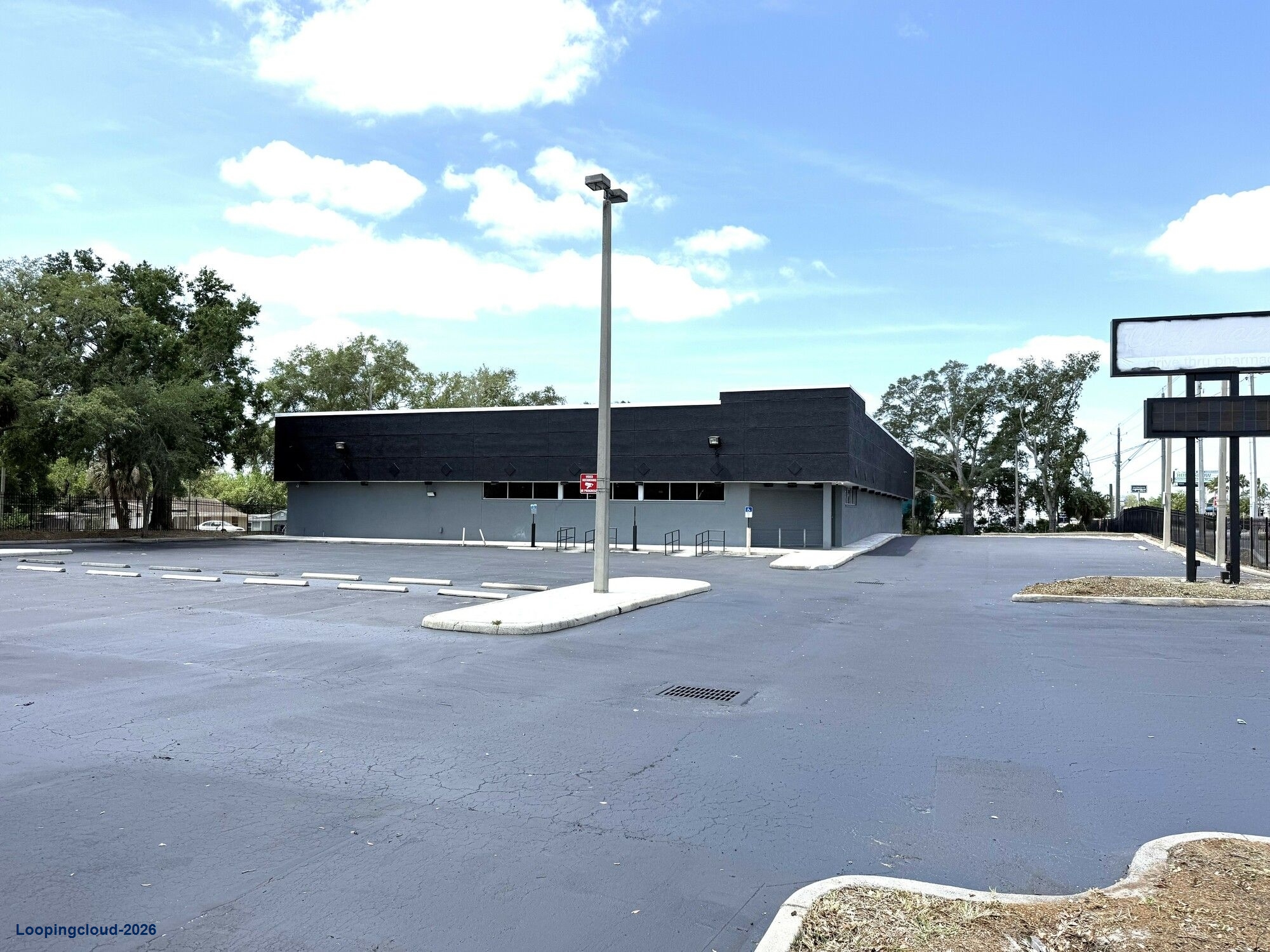 PREMIER TAMPA SHOWROOM- 13,296 SF Freestanding Building 1.42 ACRES Signalized corner LED Billboard Signage